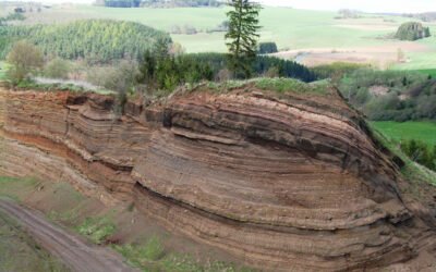 Explain rock outcrop presence in site grading